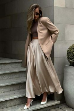 Vintage-inspired high-waisted satin maxi skirt for a timeless and chic look