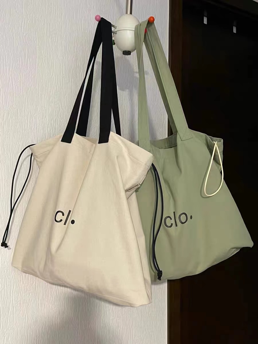 Large Capacity Canvas Drawstring Tote Bag for Commuting, Fresh Korean Style Minimalist Design with Letter Print Large Capacity Canvas Drawstring Tote Bag for Commuting, Fresh Korean Style Minimalist Design with Letter Print