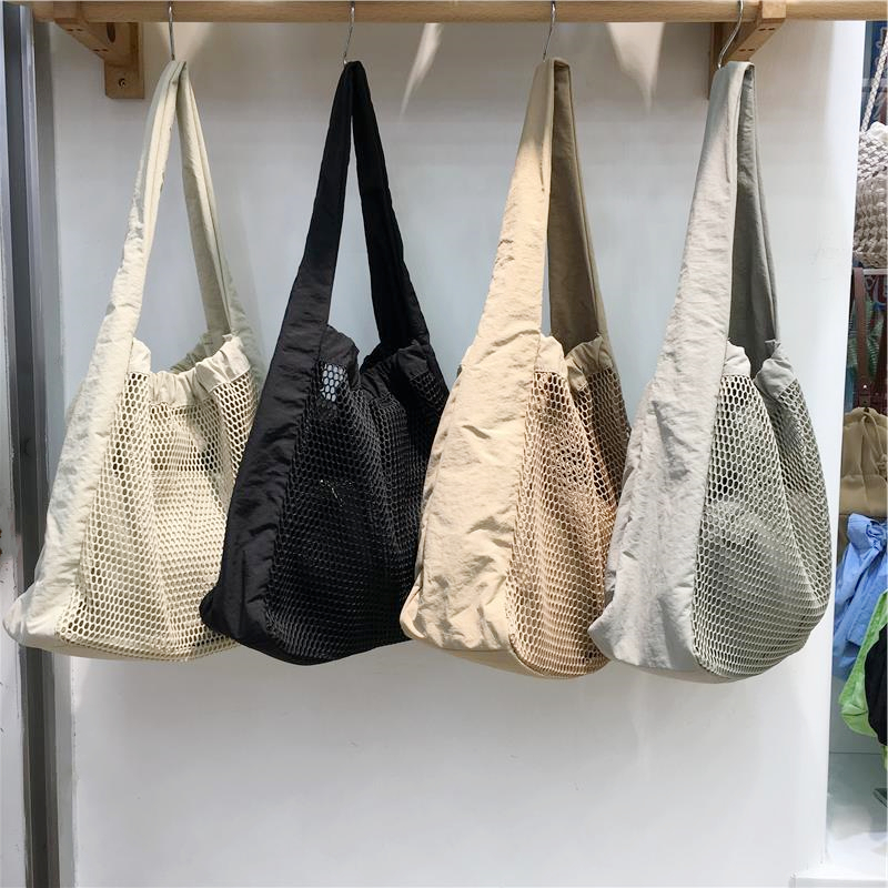 Soft Hollow Nylon Shoulder Tote Bag - Niche Design for Spring/Summer 2025 - Trendy Underarm Style for Everyday Use Soft Hollow Nylon Shoulder Tote Bag - Niche Design for Spring/Summer 2025 - Trendy Underarm Style for Everyday Use