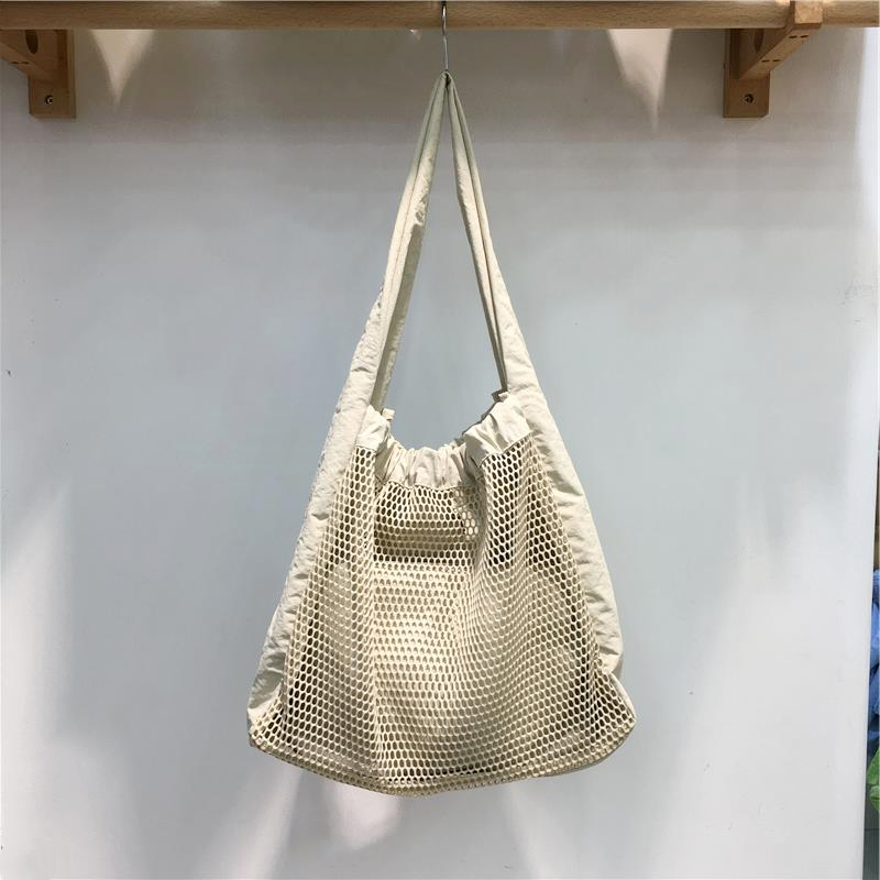 Soft Hollow Nylon Shoulder Tote Bag - Niche Design for Spring/Summer 2025 - Trendy Underarm Style for Everyday Use Soft Hollow Nylon Shoulder Tote Bag - Niche Design for Spring/Summer 2025 - Trendy Underarm Style for Everyday Use