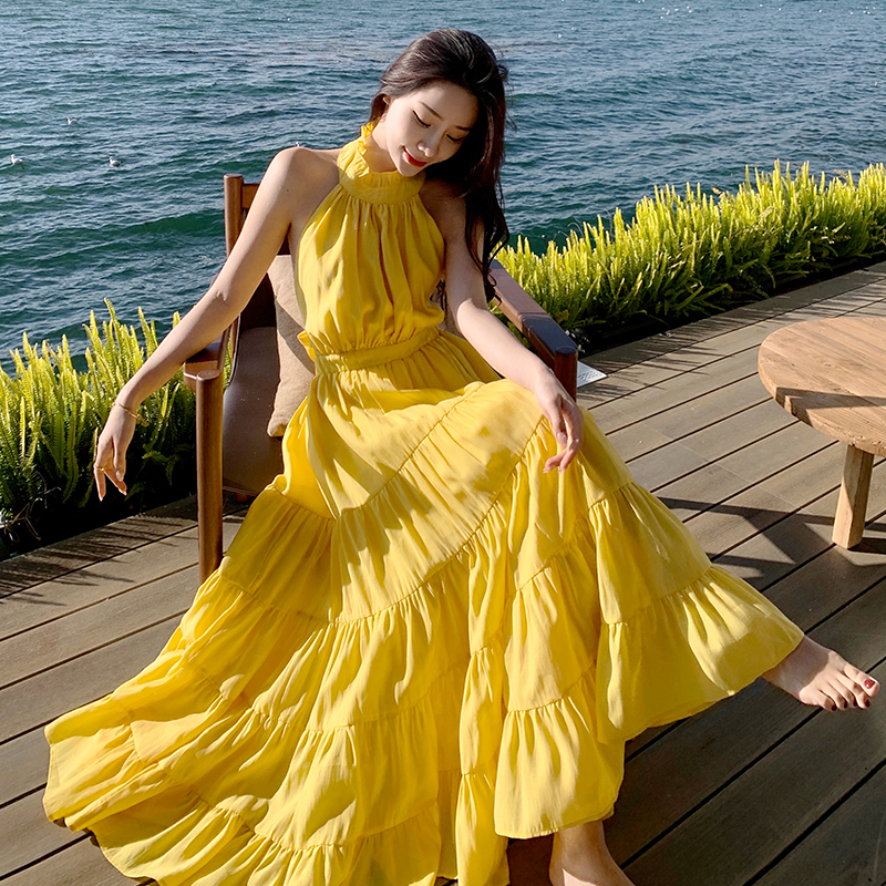 Yellow Backless Beach Vacation Dress, Slimming Long Skirt, French Design, Perfect for Sanya Travel and Summer Getaways Yellow Backless Beach Vacation Dress, Slimming Long Skirt, French Design, Perfect for Sanya Travel and Summer Getaways