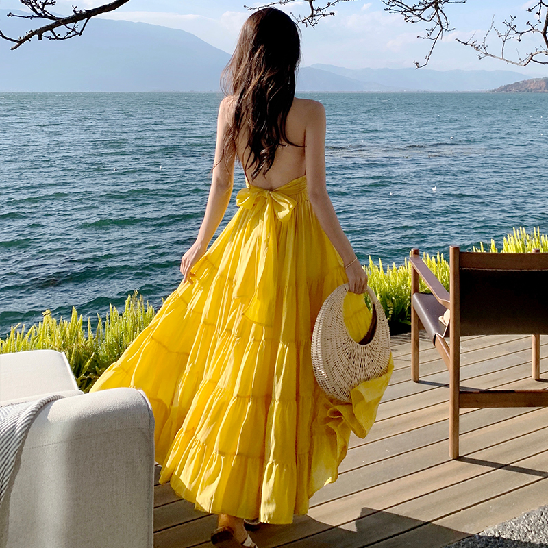 Yellow Backless Beach Vacation Dress, Slimming Long Skirt, French Design, Perfect for Sanya Travel and Summer Getaways Yellow Backless Beach Vacation Dress, Slimming Long Skirt, French Design, Perfect for Sanya Travel and Summer Getaways