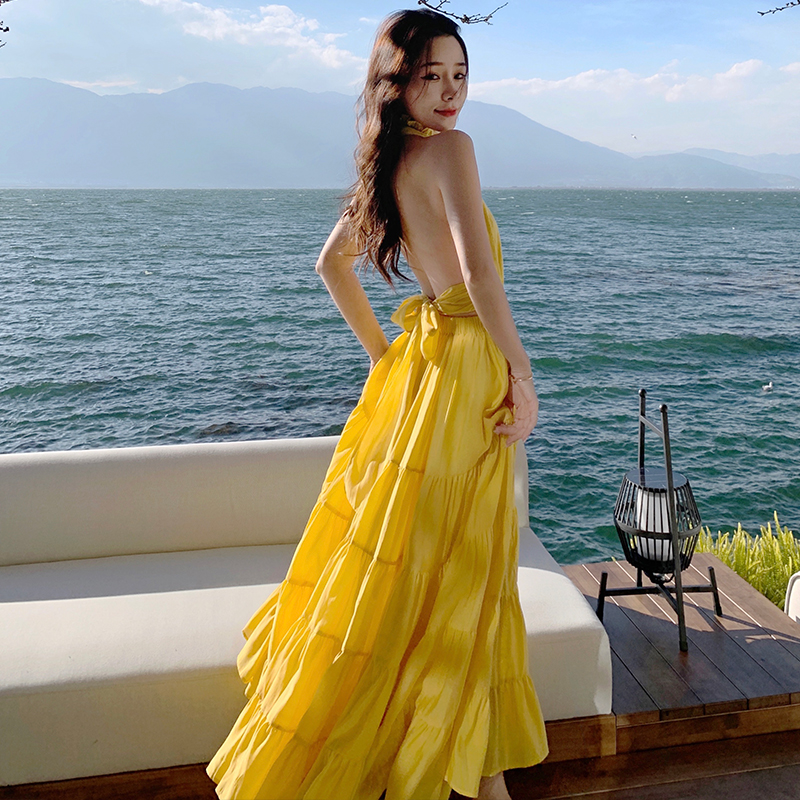 Yellow Backless Beach Vacation Dress, Slimming Long Skirt, French Design, Perfect for Sanya Travel and Summer Getaways Yellow Backless Beach Vacation Dress, Slimming Long Skirt, French Design, Perfect for Sanya Travel and Summer Getaways