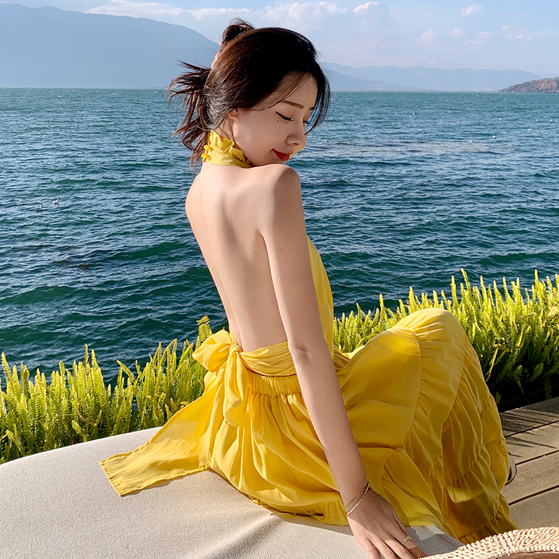 Yellow Backless Beach Vacation Dress, Slimming Long Skirt, French Design, Perfect for Sanya Travel and Summer Getaways Yellow Backless Beach Vacation Dress, Slimming Long Skirt, French Design, Perfect for Sanya Travel and Summer Getaways