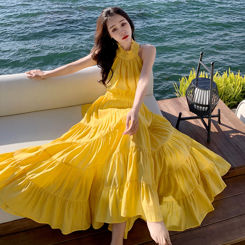 Yellow Backless Beach Vacation Dress, Slimming Long Skirt, French Design, Perfect for Sanya Travel and Summer Getaways Yellow Backless Beach Vacation Dress, Slimming Long Skirt, French Design, Perfect for Sanya Travel and Summer Getaways