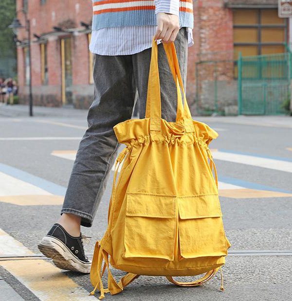 New outfit Design Double Front Pockets Simple Drawstring yellow Backpacks